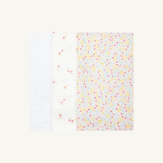 Avery Row Organic muslin squares in wildflower with a colorful floral pattern on a white background