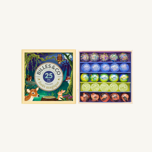 Billes & Co. Magic Forest mini box set of marbles shown closed on the left and open on the right, containing 25 colorful glass marbles in a forest-themed presentation box.