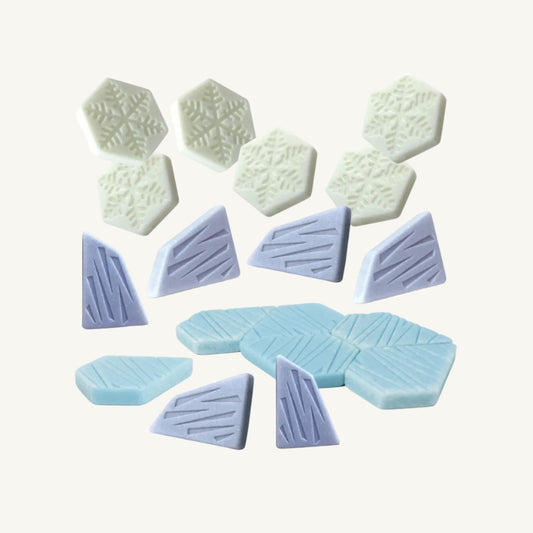 Set of polar and ice shaped blue and white sensory stones on a white background