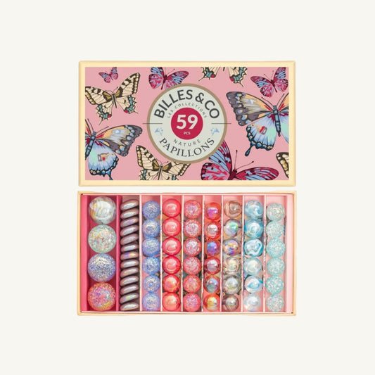 Box of decorative Billes & Co Pink Butterflies Marbles with colorful butterfly design on a pink background