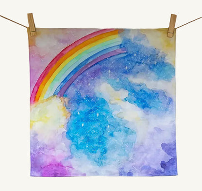Colorful rainbow organic play cloth from Wonderie on a cream background