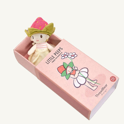 Small plush toy with a strawberry hat in a pink box labeled 'Little Peeps' on a white background.