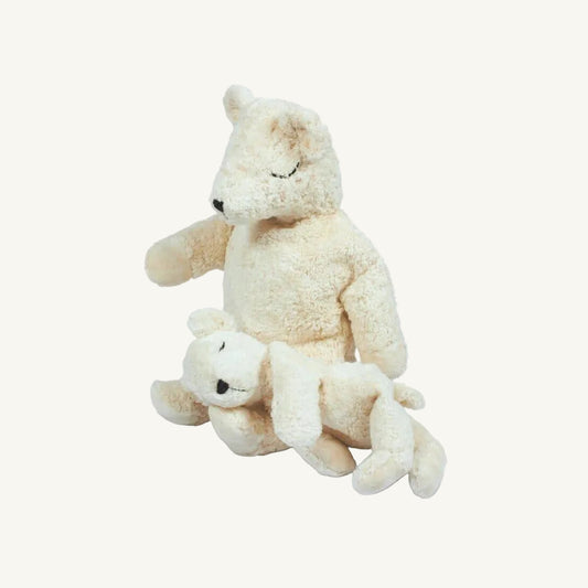 Two cream-colored polar bear plush cuddly toys, a larger one and a smaller one, on a white background
