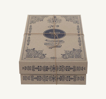 Decorative cardboard box with intricate patterns and 'Wooden Story' branding on a white background