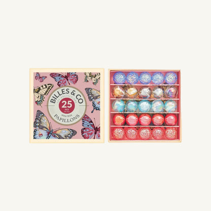 A boxed set of 25 Butterly marbles by Billes & Co, shown with the pink butterfly-patterned lid on the left and the open wooden tray of round marbles on the right against a white background.