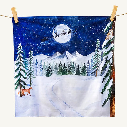 Wonderie organic play cloth chirtmas winter scene with Santa's sleigh, fox, and trees on a fabric background