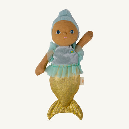 A mermaid-themed plush doll with light blue hair, a pale turquoise tutu, and a glittery gold mermaid tail, shown against a plain off-white background.