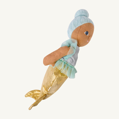 A mermaid-themed plush doll with light blue hair, a pale turquoise tutu, and a glittery gold mermaid tail, shown against a plain off-white background.
