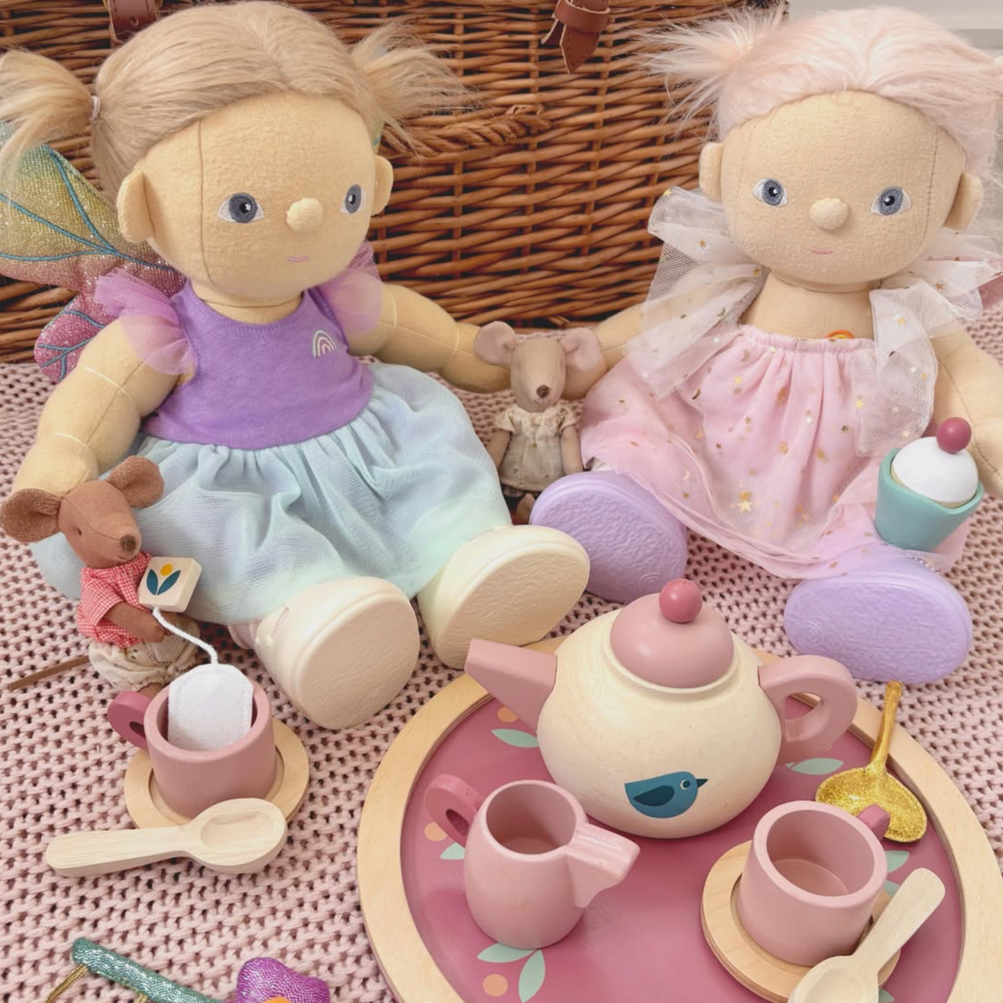 Two dolls with a tea set