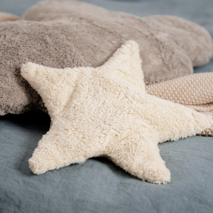 Star-shaped pillow on a textured surface
