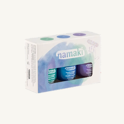 Namaki Aurora Nail varnish Kit in its original packaging, featuring a white box with a blue and purple watercolor design and a clear window showing three nail varnish bottles inside.