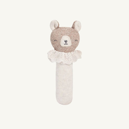 Knitted organic bear rattle with a white background