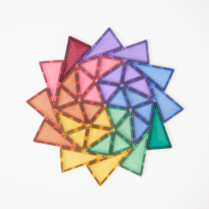 A set of translucent triangular magnetic tiles arranged in a circular spiral pattern on a clean white background.