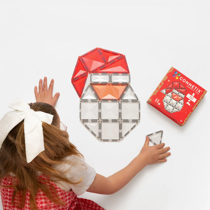 Girl building a CONNETIX Magnetic tiles Christmas Santa Pack 